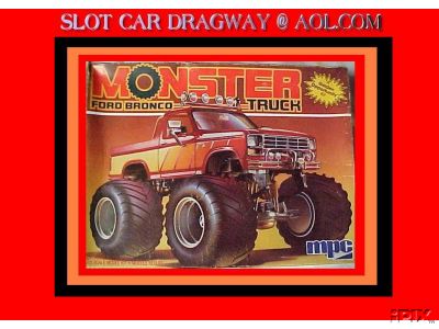 1979 Ford Bronco - Photo of an MPC model kit box lid for a "Monster Ford Bronco 4x4 Truck," showing box art of a red lifted Bronco on huge flotation tires aga…