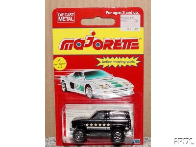 1979 Ford Bronco - A black toy SUV with white stars is displayed in its original packaging.