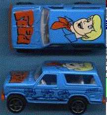 1979 Ford Bronco - A blue toy Bronco features Scooby-Doo graphics and 'SUPERMOTORS' branding on its side.
