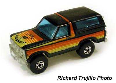 1979 Ford Bronco - A 1979 Ford Bronco toy is shown from a three-quarter front angle against a white background.