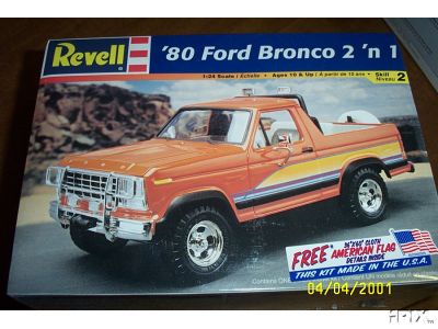 1979 Ford Bronco - Photo of a sealed Revell 1/24 scale "'80 Ford Bronco 2 'n 1" model kit box, with box art of an orange Bronco with tan and brown side stripe…