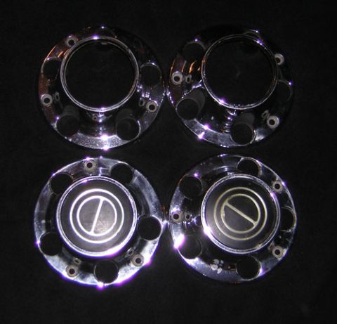 1995 Ford Bronco - Set of four chrome hubcaps, two with center caps, for sale.