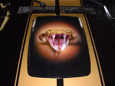 1978 Ford Mustang II - This car features a striking airbrushed cobra on its hood, accented by gold racing stripes.