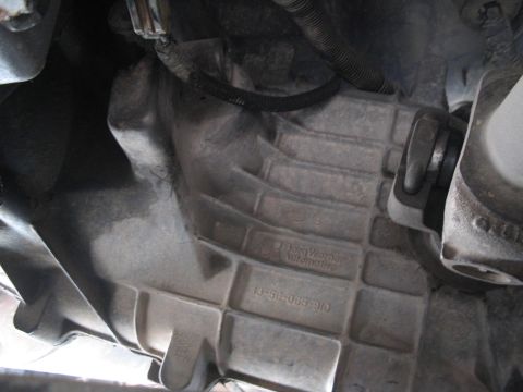 1991 Ford Bronco - Close-up of a transmission housing showing manufacturer markings and a part number.