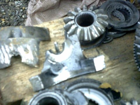 1995 Ford Bronco - Close-up of damaged differential gears and metal housing components.