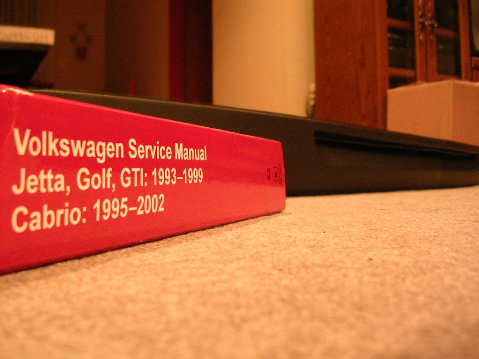 Red Volkswagen service manual for 1993-1999 Jetta, Golf, GTI and 1995-2002 Cabrio