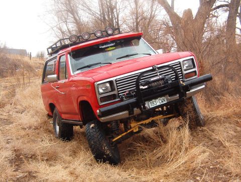 1985 Ford Bronco - This red 1985 Ford Bronco is equipped for off-road adventures with a winch and auxiliary lighting.