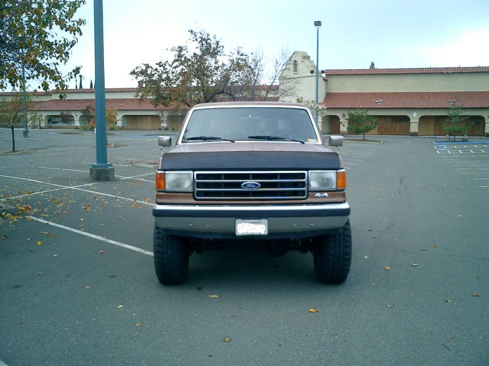 1990 Ford Bronco parked in a lot, front view