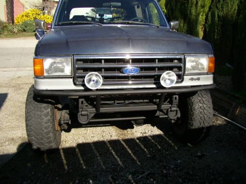 1989 Ford Bronco - Front view of a 1989 Ford Bronco, highlighting its heavy-duty bumper and recovery points.