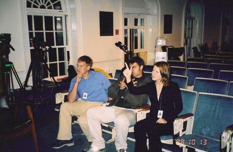 1999 Jeep Grand Cherokee - Three people are seated in an auditorium, with cameras visible in the background.