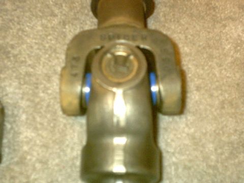 1995 Ford Bronco - Close-up of a universal joint, likely a D50 slipshaft component, with visible blue seals and stamped lettering.