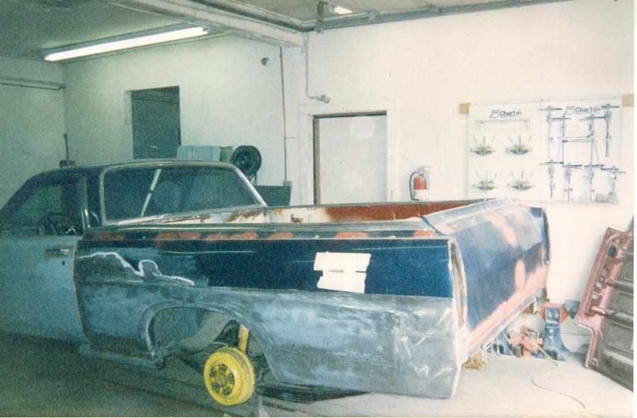 1968 Ford Ranchero bodywork in progress, primer and body filler visible on the rear quarter panel and bed
