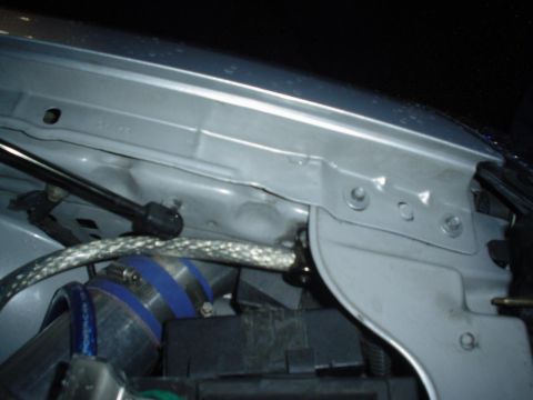 1993 Ford Taurus - Close-up view of an engine bay, showing various components and silver paintwork.