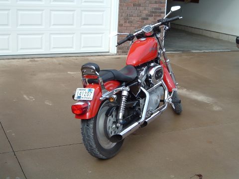 1995 Mercury Grand Marquis - Rear view of a red motorcycle with an Indiana license plate.