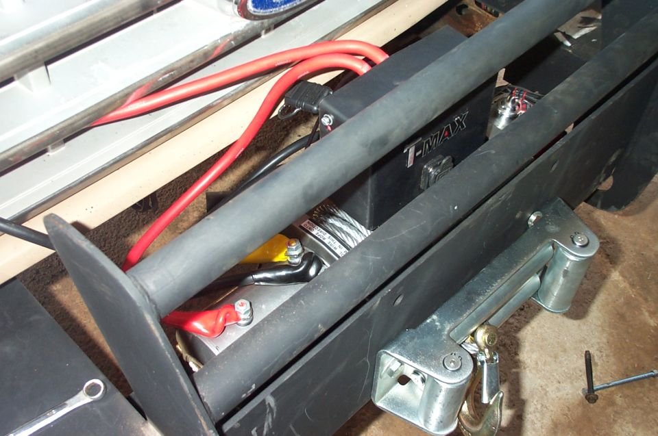 Winch and bumper assembly with red cables and T-MAX branding