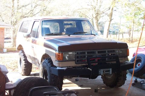 1987 Ford Bronco - A 1987 Ford Bronco is shown with a custom front bumper and winch.
