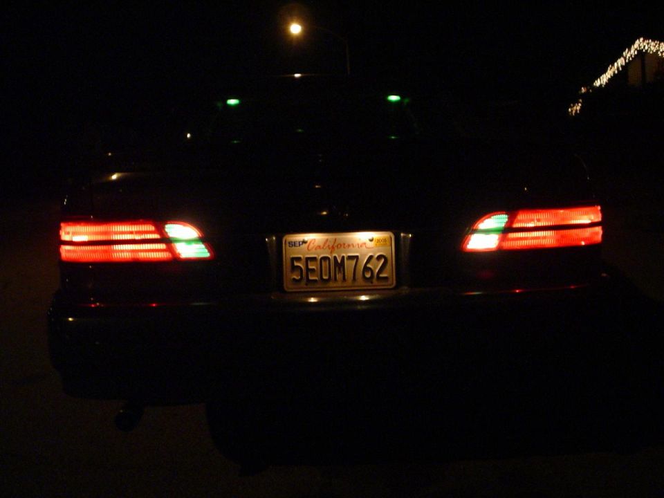 car's rear with taillights on and California license plate 5EOM762