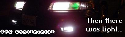 1993 Ford Taurus - The front of a dark sedan is illuminated by its headlights and fog lights, with text overlays reading 'SHO Continental' and 'Then there was…