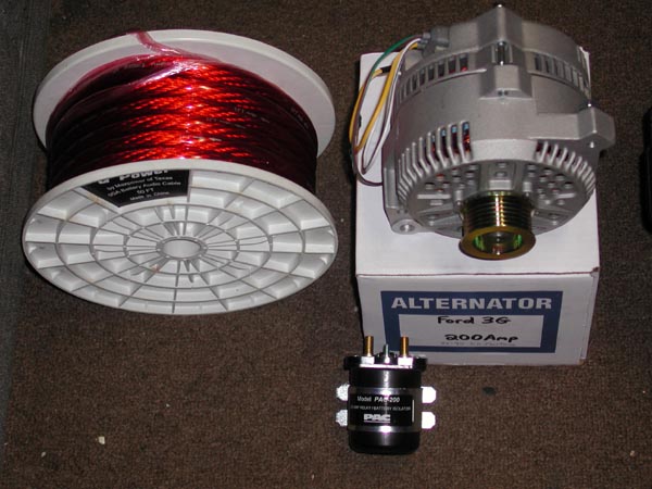 Ford 3G 200A alternator, red power cable spool, and black PAC relay on carpet