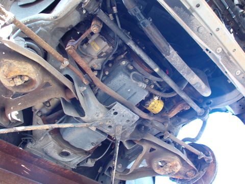 1994 Ford Crown Victoria - This photo shows the underside of a vehicle, focusing on the engine and suspension system.