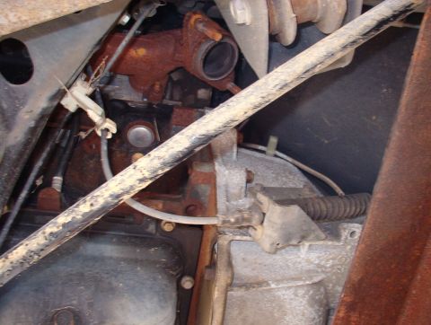 1994 Ford Crown Victoria - Underside view of engine and transmission components, showing signs of rust and wear.