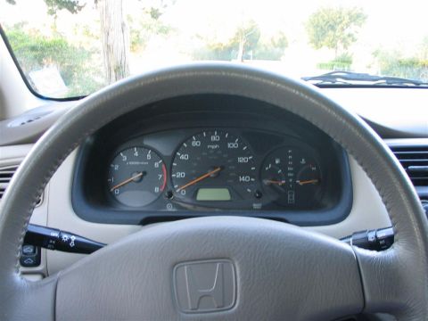 2000 Honda Accord - The dashboard of a Honda Accord shows the speedometer, tachometer, and gear selector.