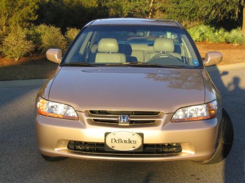 2000 Honda Accord - Front view of a gold 2000 Honda Accord, its distinctive grille and headlights. The license plate is visible.