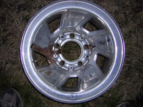 1995 Ford Bronco - This aluminum wheel shows significant rust damage around the center hub.