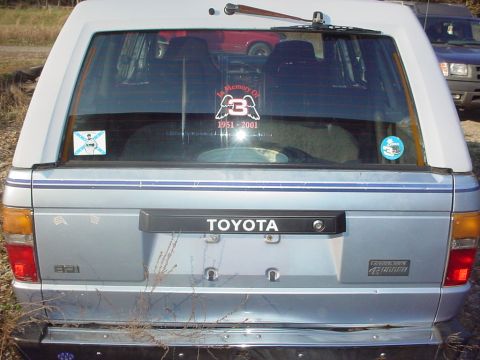 1988 Toyota 4Runner - The rear of a silver SUV, identified as a 4Runner by its badge, is visible with a "TOYOTA" emblem on the tailgate.