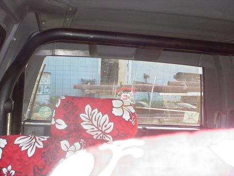 1988 Toyota 4Runner - Custom seat covers and roll bar visible inside the vehicle's interior.