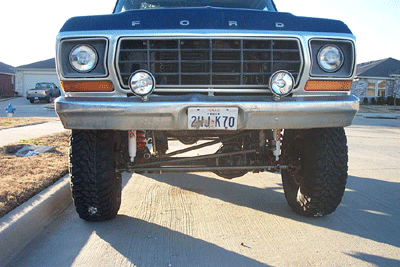 1978 Ford Bronco - Front view of a lifted 1978 Ford Bronco with a chrome bumper and black grille.