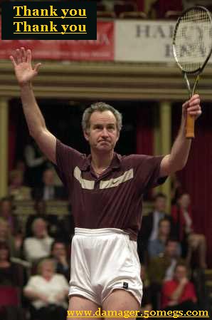 1986 Ford Bronco - John McEnroe acknowledges the crowd after a match, holding his tennis racket aloft.