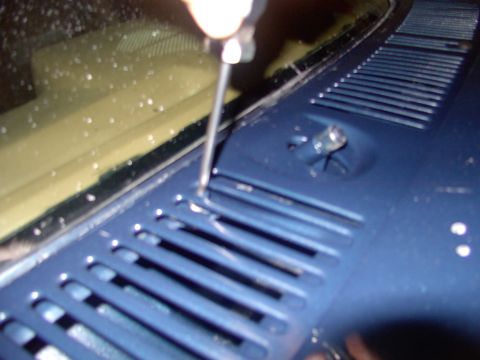 1986 Ford Bronco - Remove the upper 5 phillips screws from in between the slots on the cowl/valance. May as well get you magnetic pick up tool out now because…