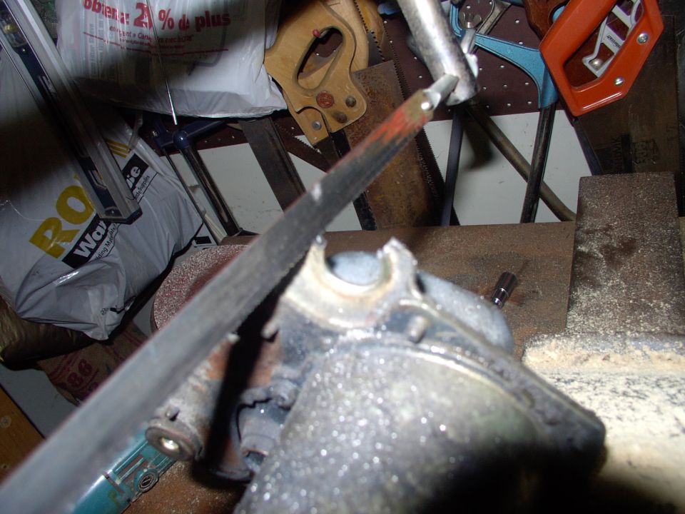 I broke out the hack saw and liberated my old isolation mounts. There's gonna be violence if there's any trouble returning the old "modified" motor for the core charge !