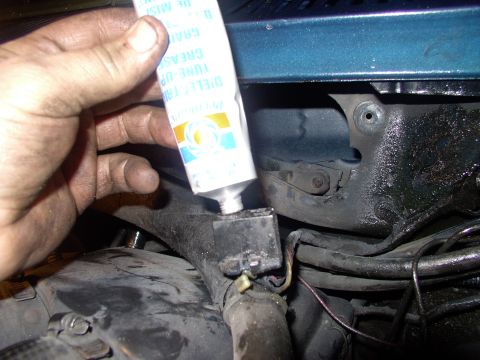 1986 Ford Bronco - Here I am sqeezing dielectric grease into the wiper harness plug to prevent corrosion and encourage conductivity.