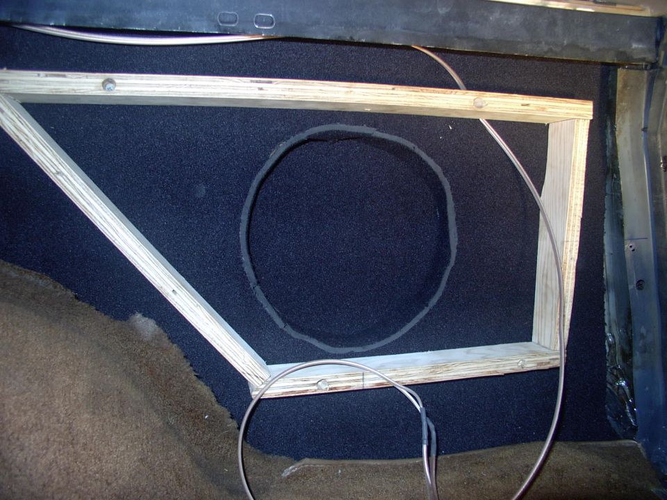 There's the inner quarter and indented woofer recess insulated and the plywood box sides screwed to the rear quarter, with the 14 gauge speaker wire ready to go.