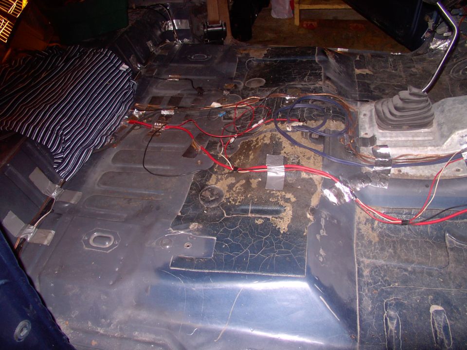After all the extensive panel replacement and painting it's time to put the interior back together in the 86 Eddie.  First I layed out most of the stereo wiring and taped it down making sure it was out of the way of the seat brackets,etc.