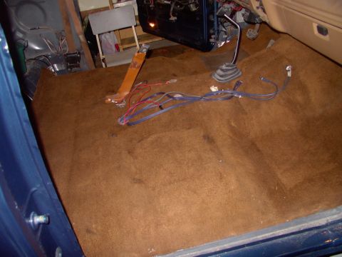 1986 Ford Bronco - It's much easier to run all the sterro wiring, even with the rug down, than after the front seats get bolted in.