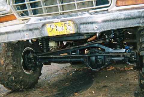 1978 Ford Bronco - Close-up of the front axle and suspension system on a 1978 Ford Bronco, an Oregon license plate.