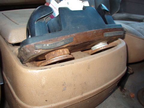 1983 Ford Bronco - To avoid putting holes in the original console, I weighted the wood plate to hold it down. The foam keeps it from moving or making noise. S…