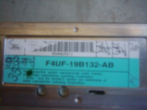 1978 Ford Bronco - A close-up of a Ford part label shows a barcode and part number.