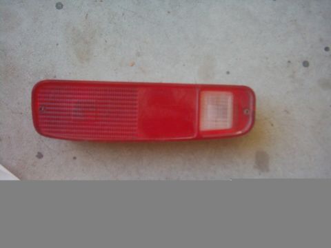 1978 Ford Bronco - This red taillight assembly features a ribbed lens and a clear section for the bulb.