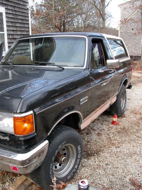 1989 Ford Bronco - This 1989 Ford Bronco is seen in a 3/4 front view, parked outdoors.