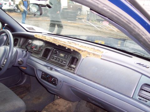 1991 Ford LTD Crown Victoria - Dashboard interior of a 1991 Ford Crown Victoria LTD shows significant wear and tear on the dash pad.