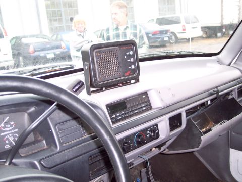 1991 Ford LTD Crown Victoria - The dashboard of a 1991 Ford Crown Victoria LTD shows an aftermarket radio and a CB unit mounted on top.