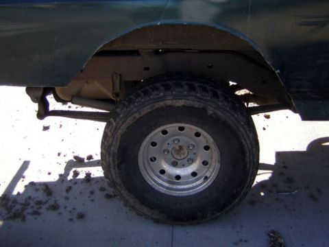 1995 Ford Bronco - Close-up of the rear wheel and suspension system on a 1995 Ford Bronco.