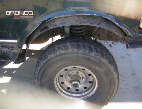 1995 Ford Bronco - The 'BRONCO XLT' badge is visible on the fender of this 1995 Ford Bronco.