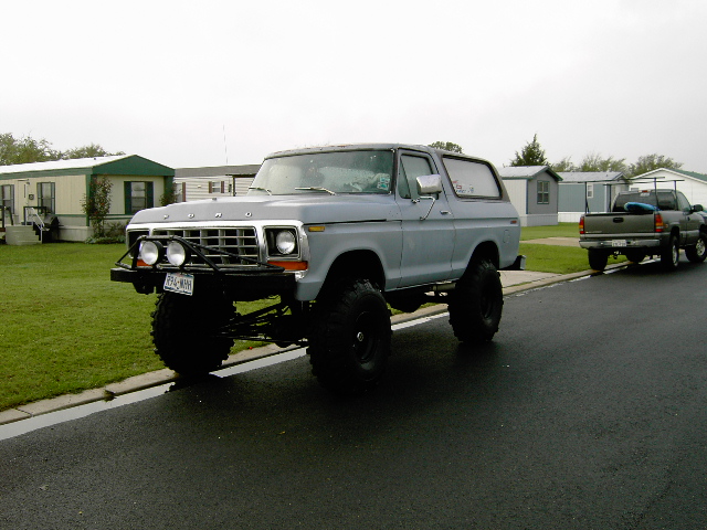 Lifted 1978 Ford Bronco with large tires and brush guard