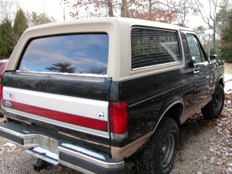 1989 Ford Bronco - Rear view of a 1989 Ford Bronco with a two-tone paint scheme.