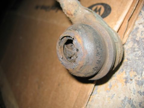 1985 Ford LTD Crown Victoria - A heavily corroded ball joint shows significant wear and tear, indicating a need for replacement.